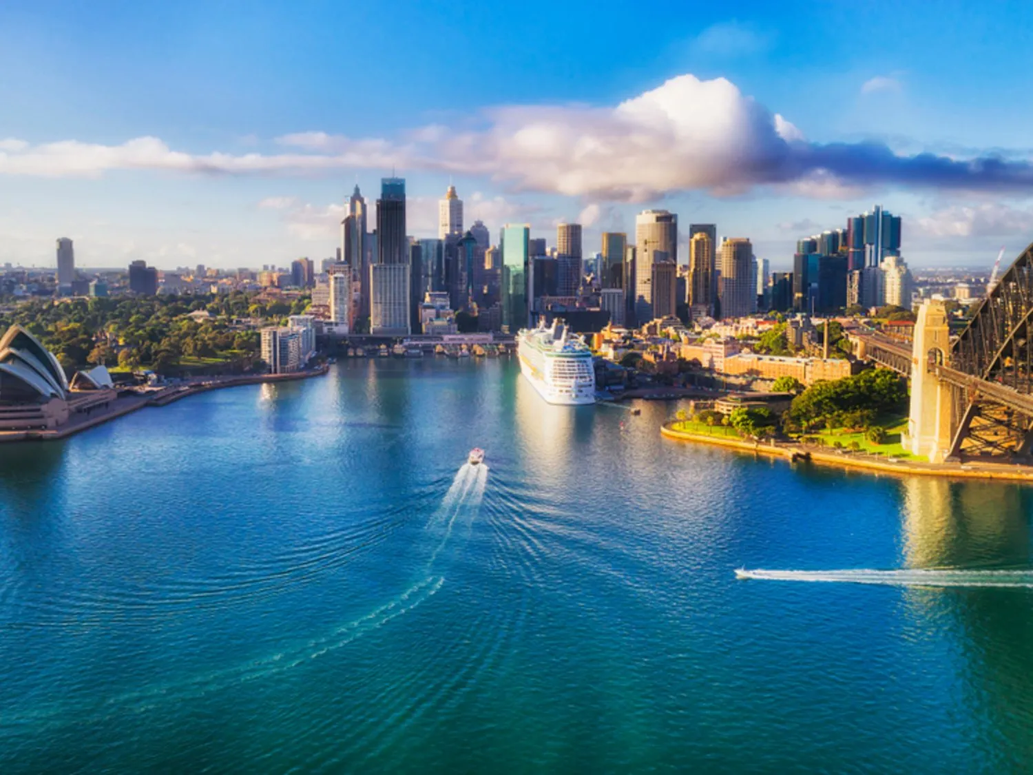 Major architecture landmarks of the city of Sydney and Australia around Sydney harbour in elevated aerial view in warm smooth sunlight at the morning