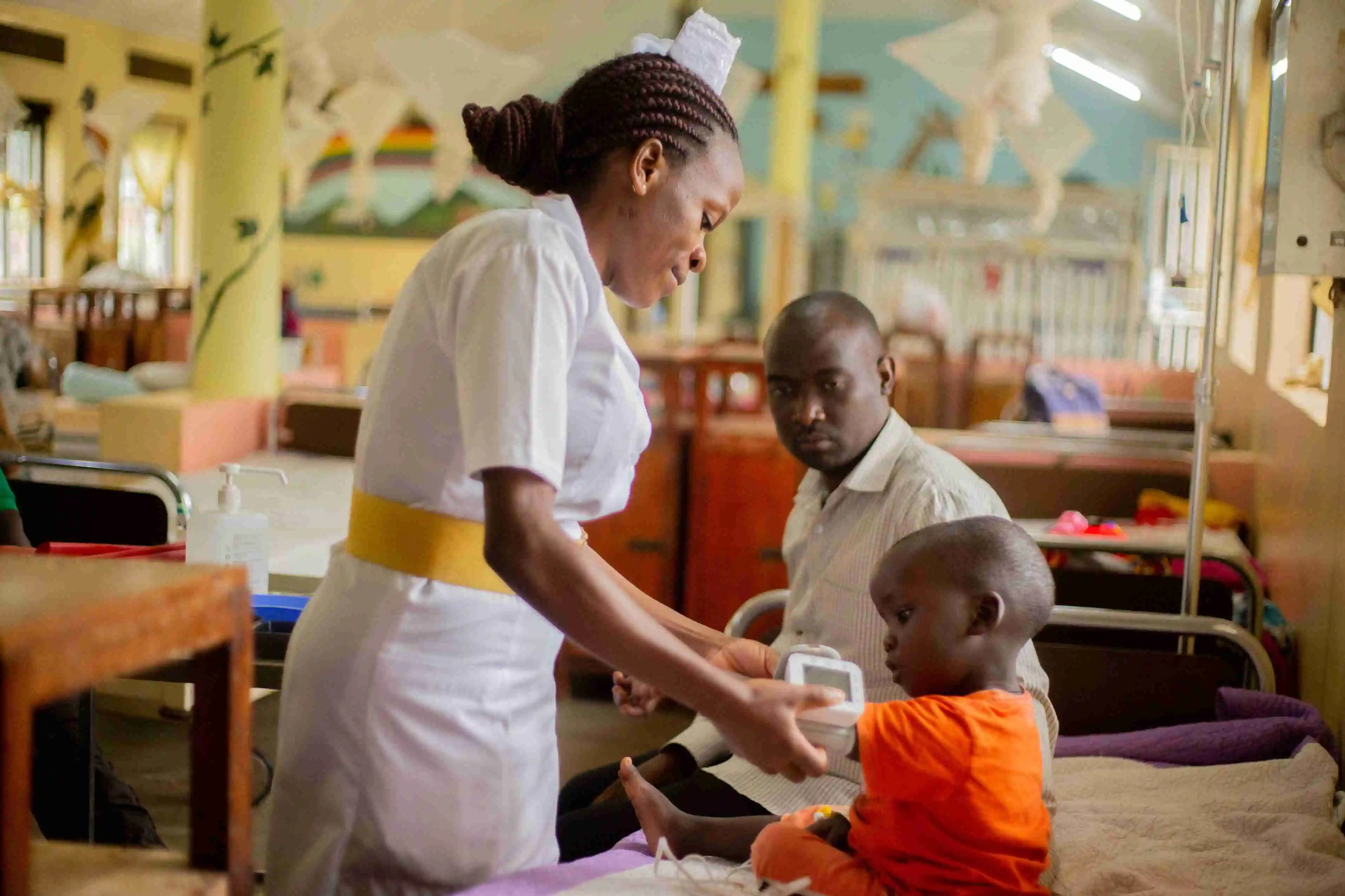 Nurse with a child in Uganda.