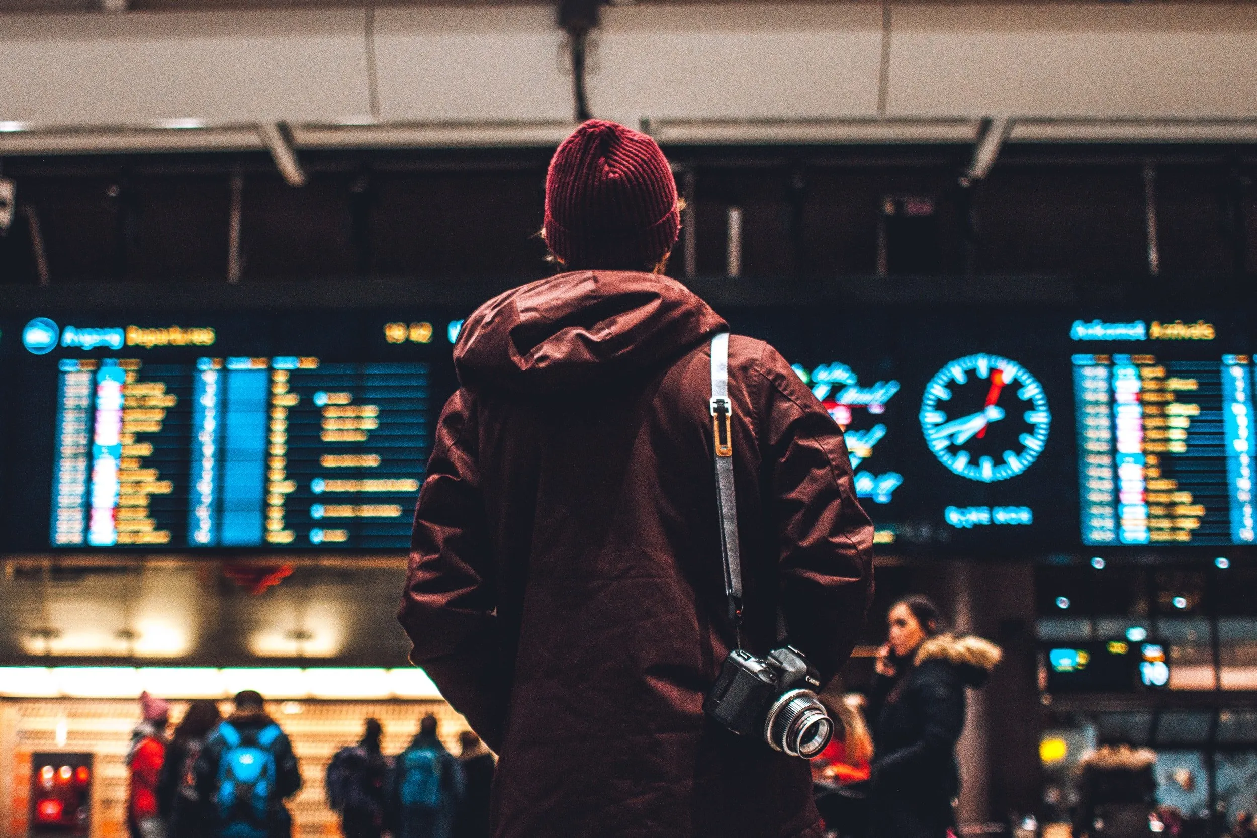 Man looking at flights board