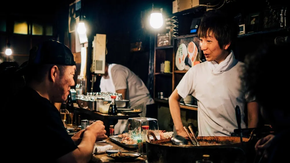 Asiatic people socialising