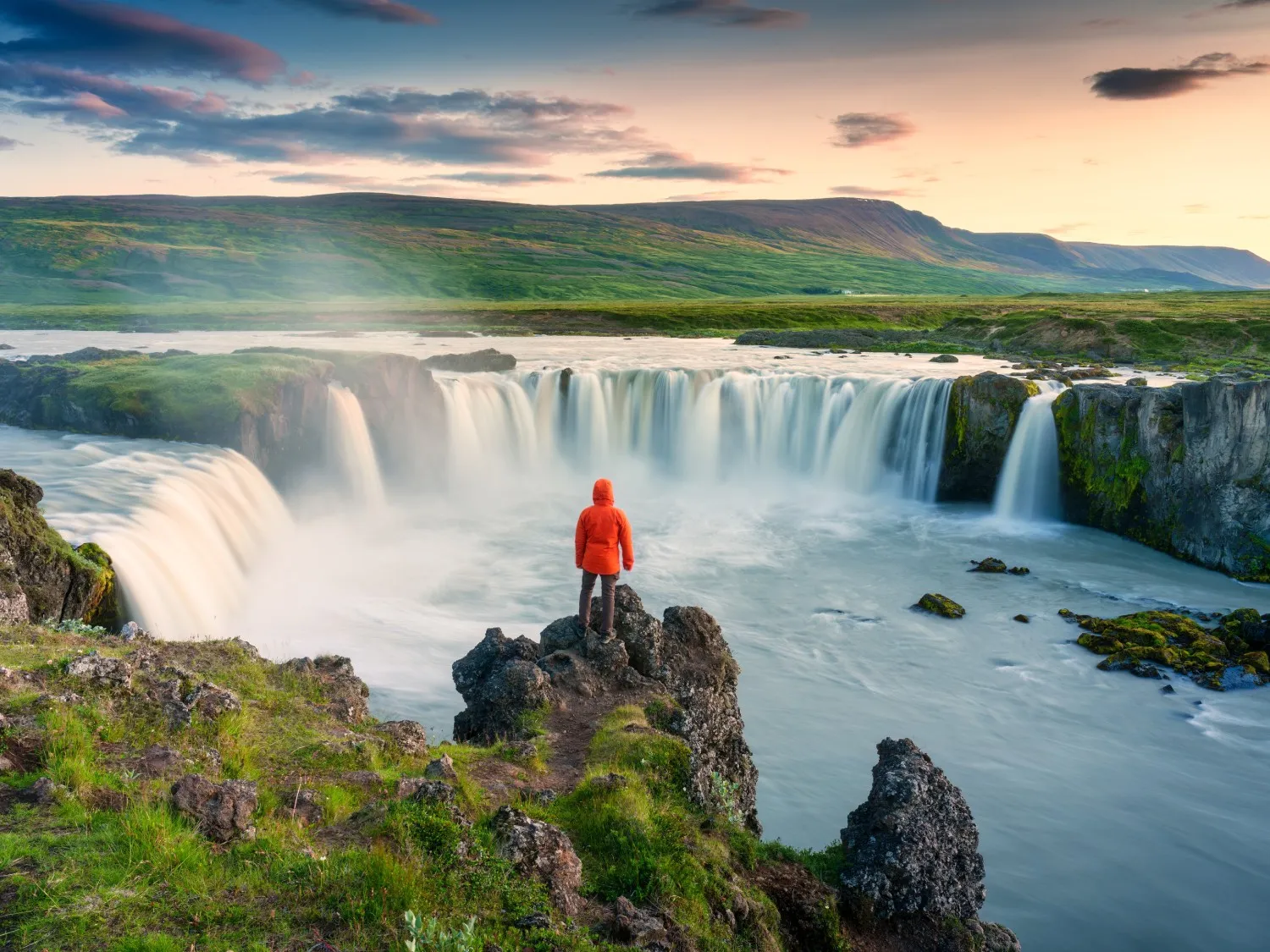 Waterfalls in Iceland and a tourist